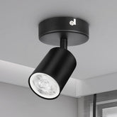Black ceiling light fixture on a gray ceiling